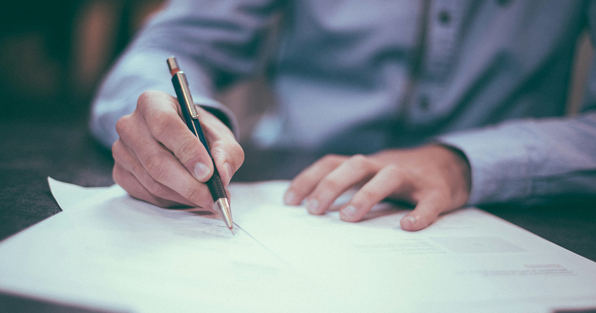 person signing a contract