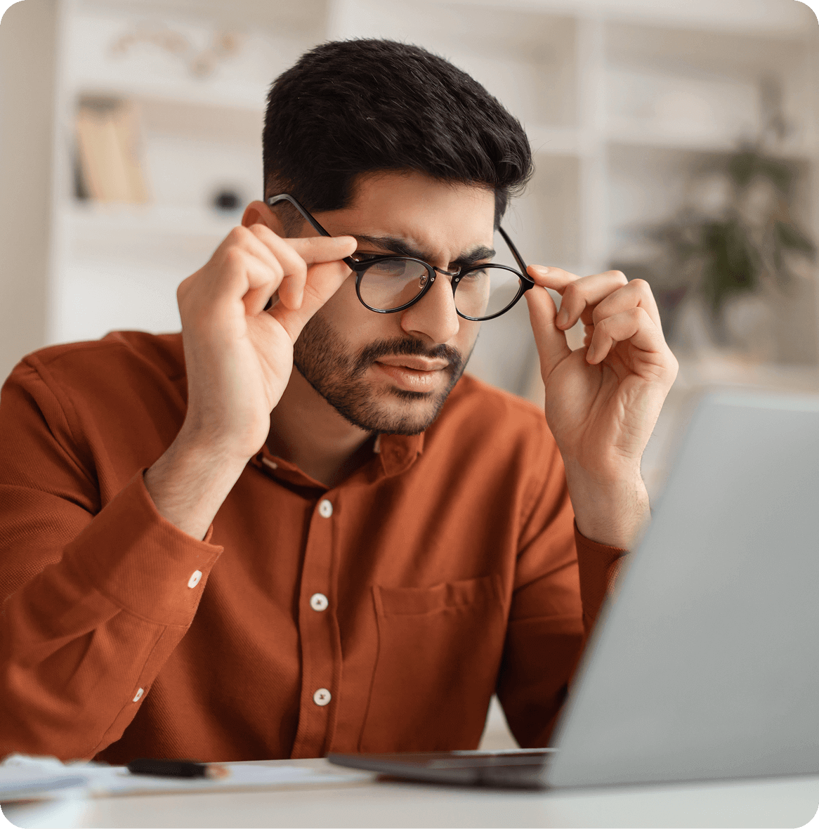 man holding eyeglasses