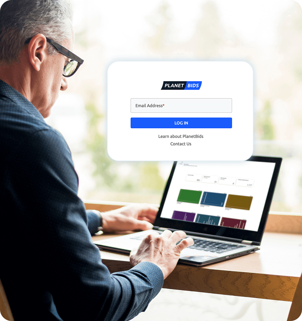 man in front of a laptop logging to PlanetBids app