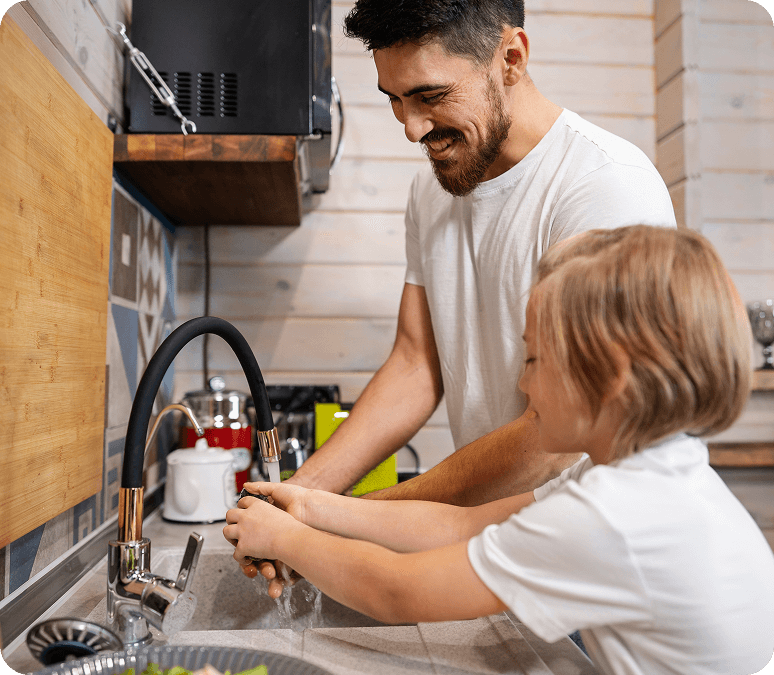 son and dad washing their hands