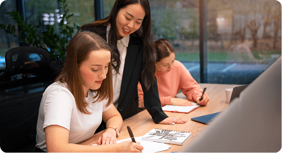 women working on a table