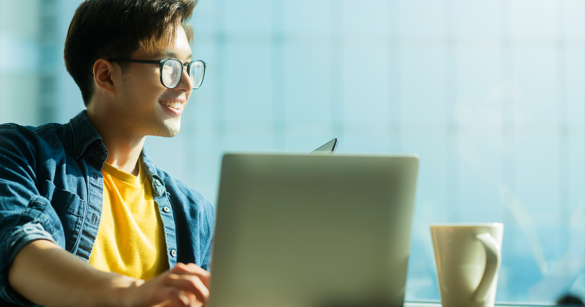 young man using a laptop