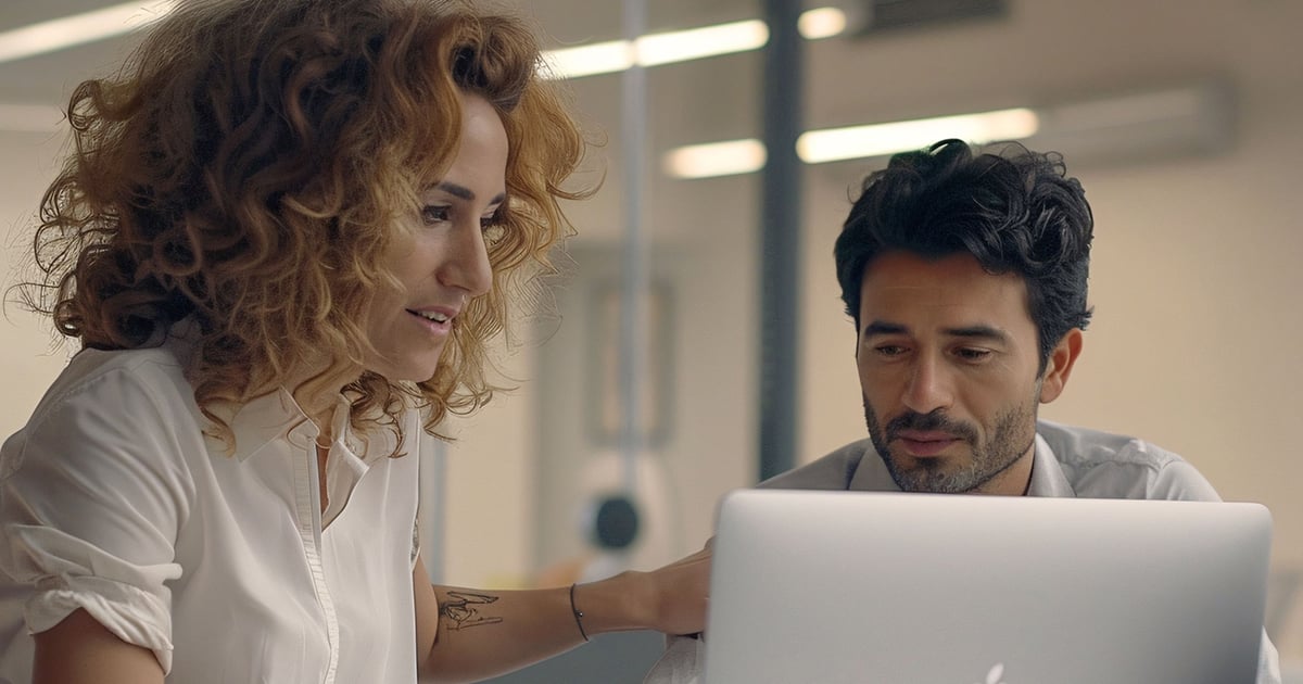 2 people working together