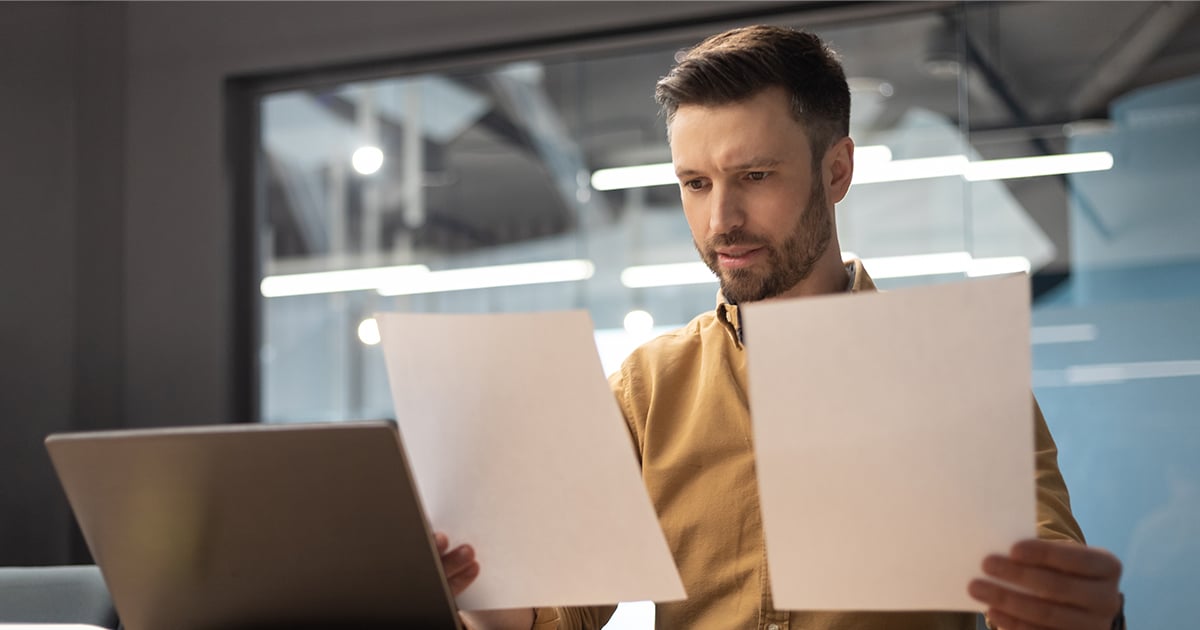 man reviewing documents