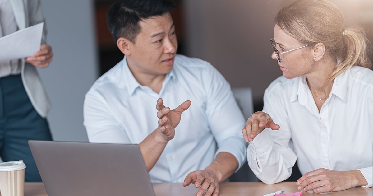 Colleagues discussing a problem in the office